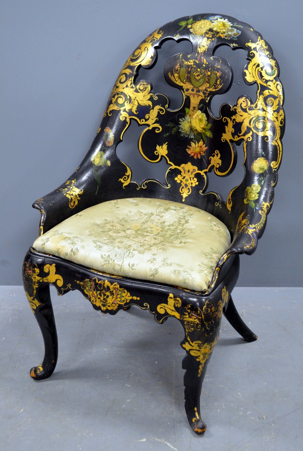 Jennens & Bettridge papier mache black lacquered, gilt and painted armchair on carved cabriole