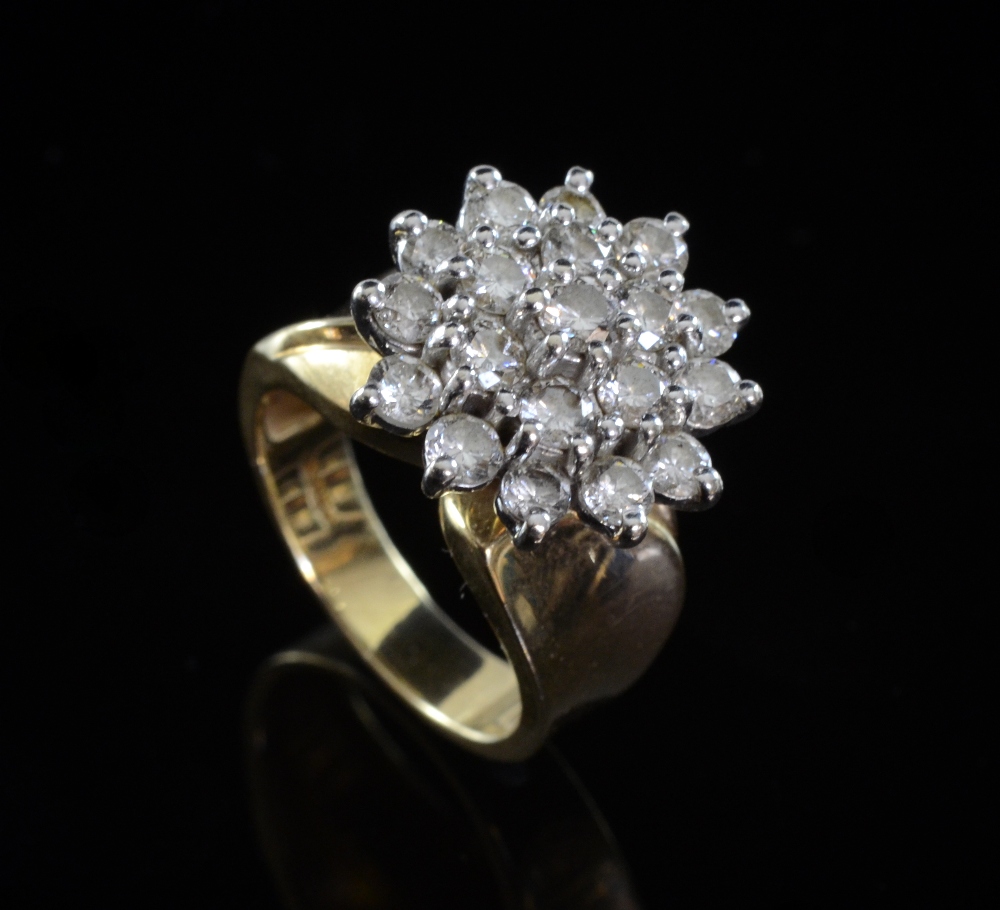 Diamond cluster ring in white and yellow gold setting