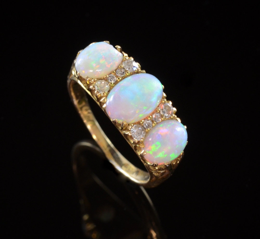 Victorian opal and diamond ring Oval cabouchon opals measuring 8 x 6 mm and 6.5 x 4.5 yellow