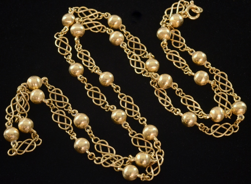 Gold necklace with orbs connected by fancy links 18ct gold