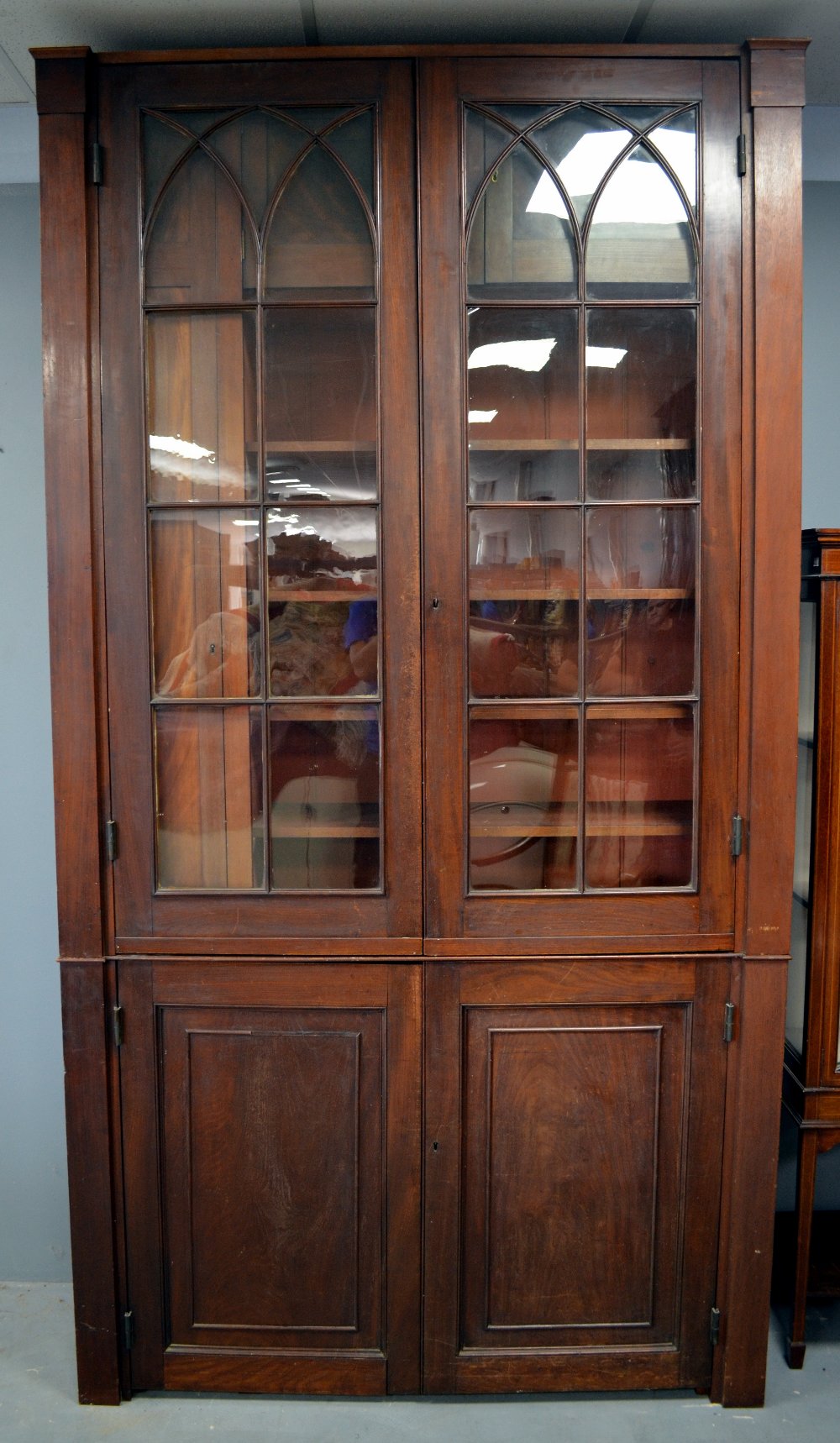 19th century mahogany bookcase, two cupboard doors above two glazed doors over base with two