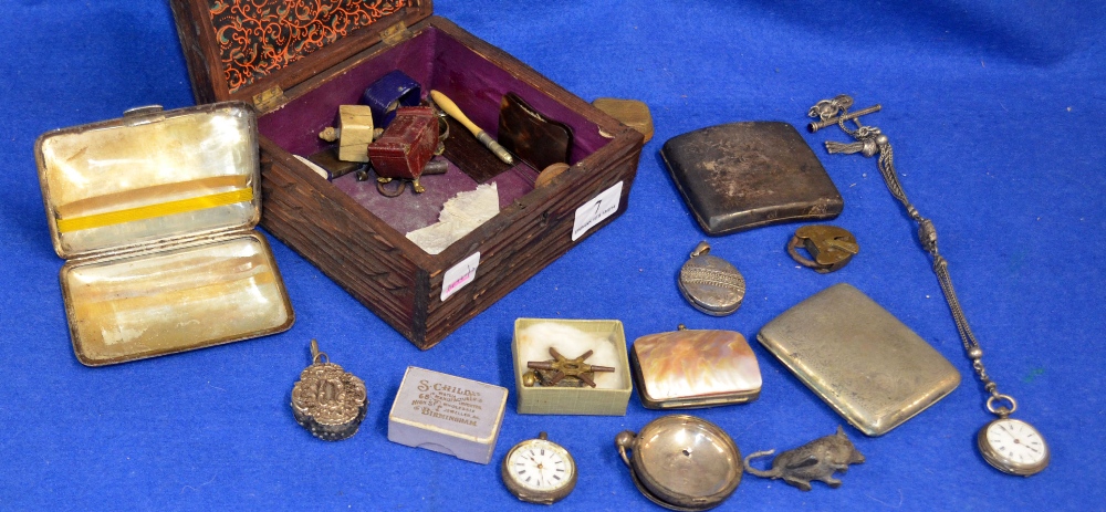 Oak carved box with contents, to include two silver cigarette cases, pocket watches, small amount of