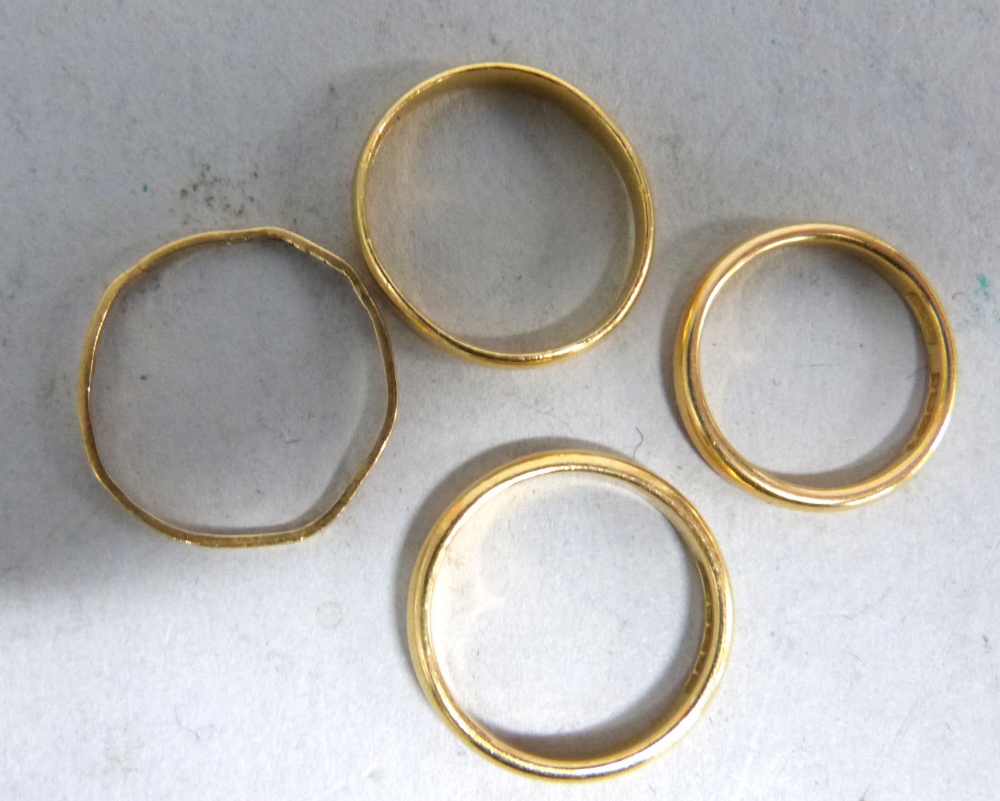 Four 22ct gold wedding bands, weight 9.4 grams