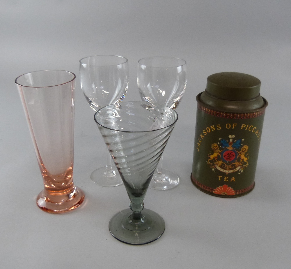 Various glassware to include dressing table jars and covers, and a selection of metal tea caddies