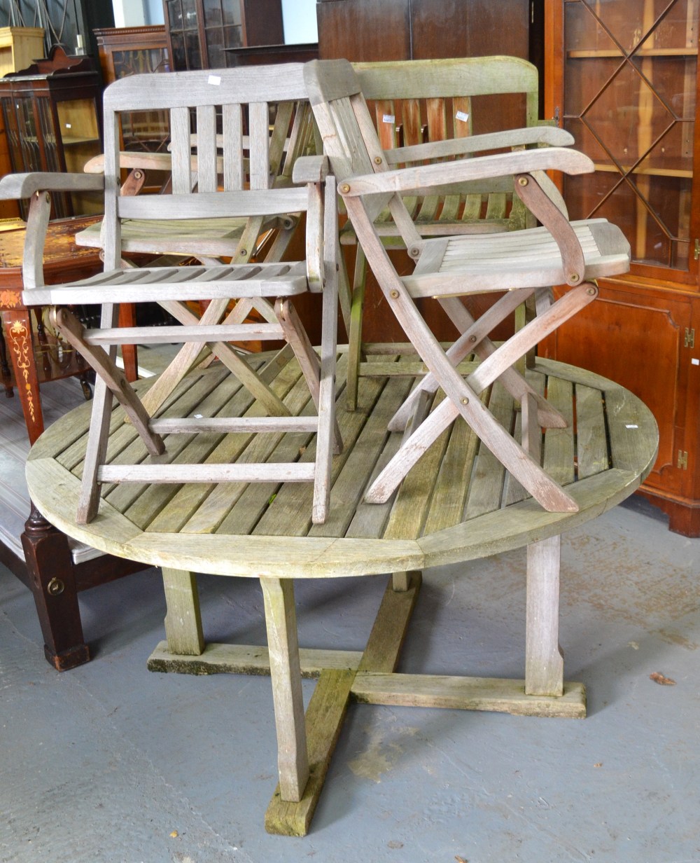 Large circular wooden garden table and set of five chairs