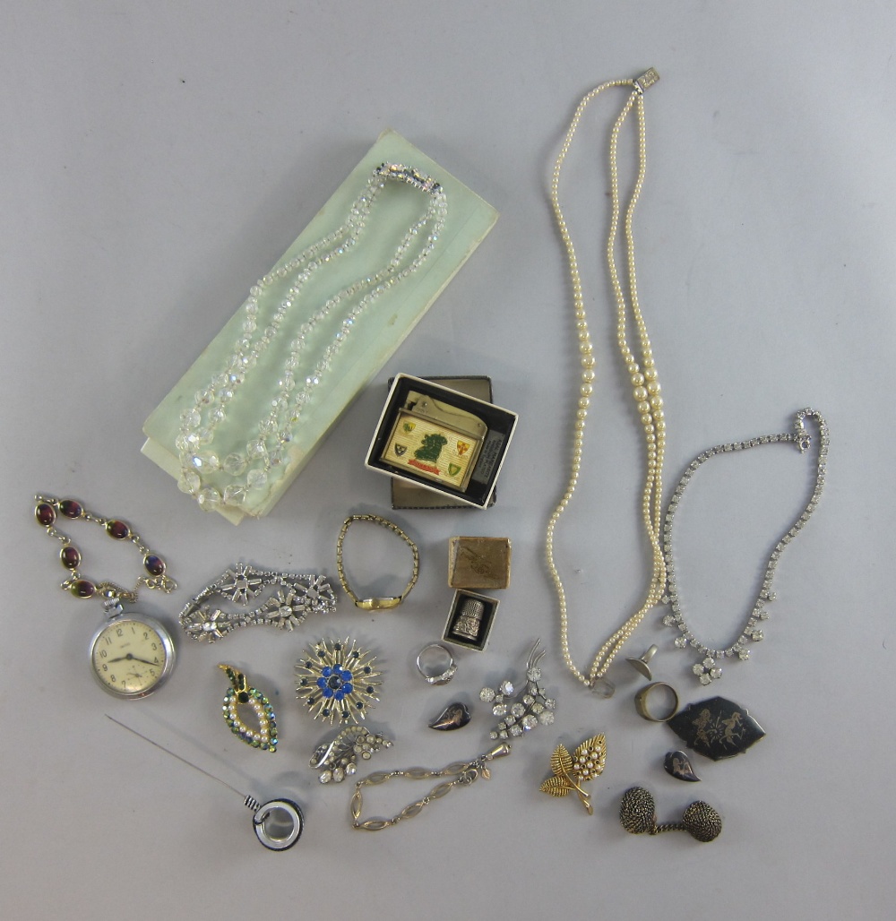 Small collection of costume jewellery to include a pocket watch and brooches