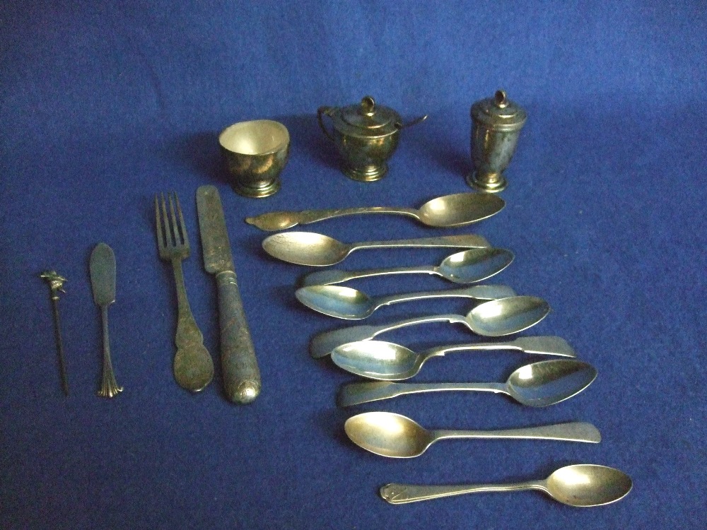 George V silver three piece cruet, ten spoons, matching fork and knife and a butter knife 12oz,