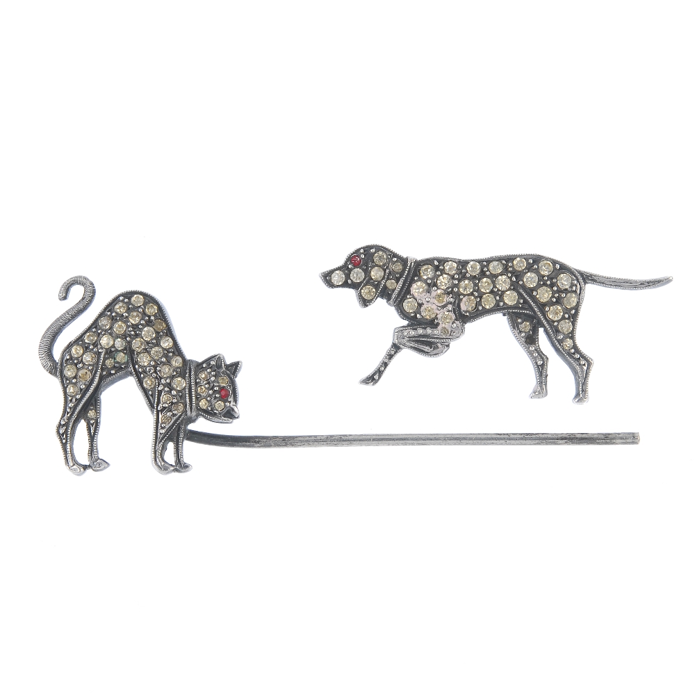 A paste cat and dog jabot pin, the pin cap designed as a prowling dog and the pin terminal designed