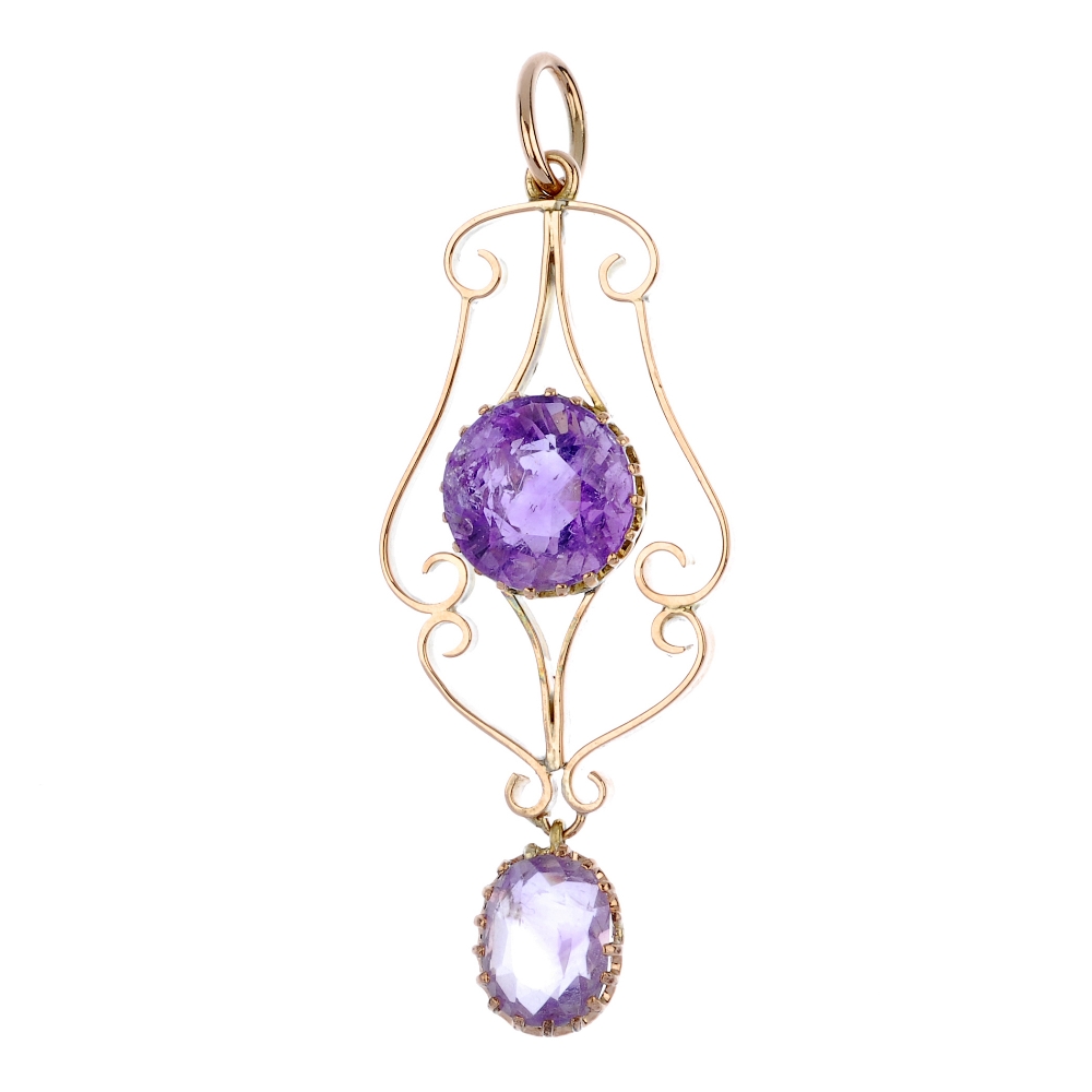An early 20th century 9ct gold amethyst pendant. The oval-shape amethyst, suspended from a