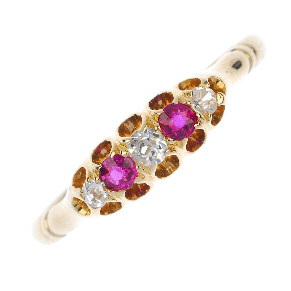 An early 20th century 18ct gold ruby and diamond ring. The graduated old-cut diamonds, with