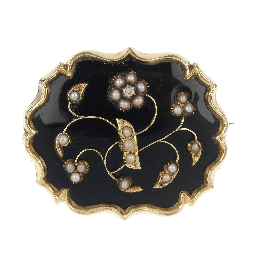 A late Victorian gold split pearl and enamel memorial brooch, designed as a shaped outline with