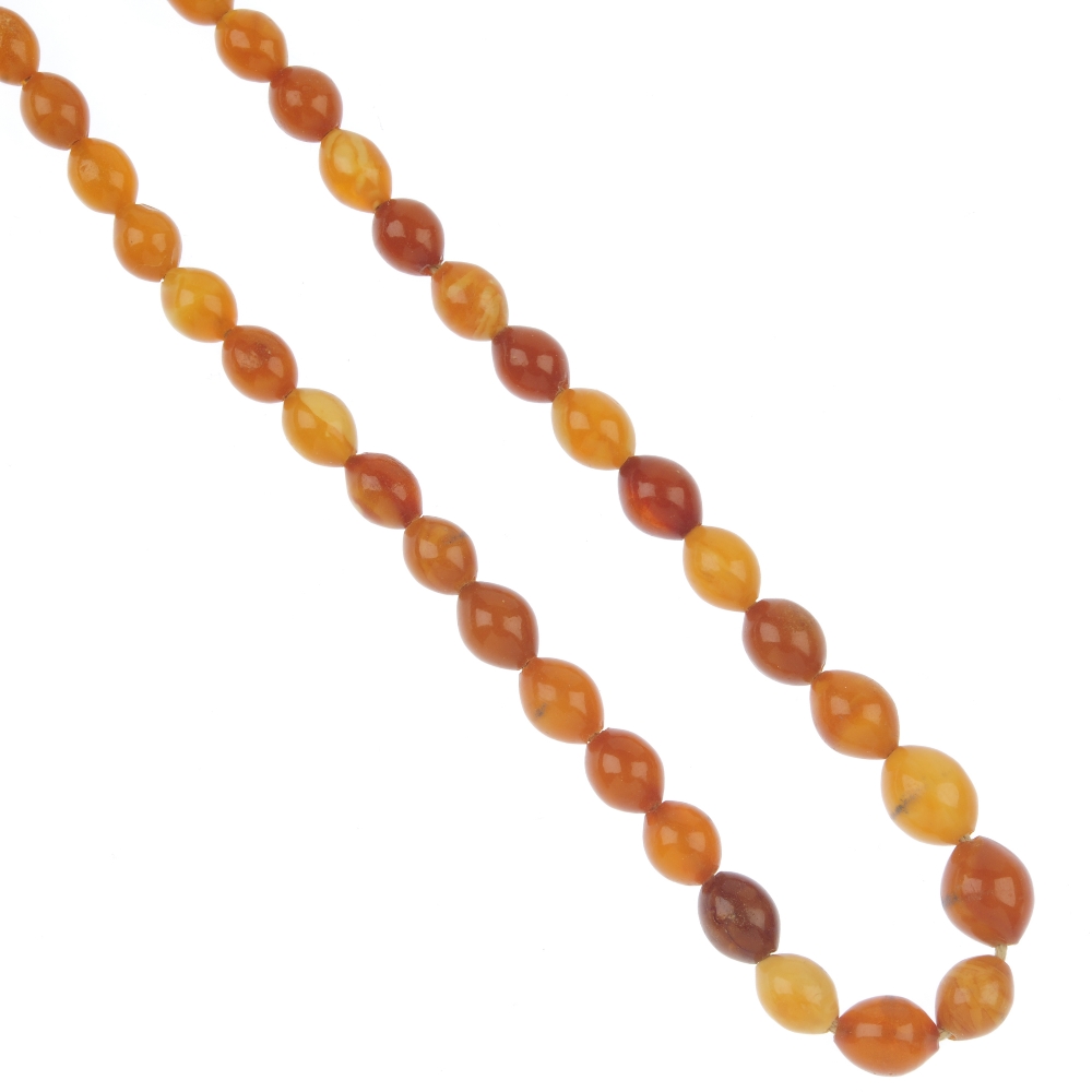 A natural amber bead necklace, designed as forty-eight graduated Istanbul cut beads, measuring 12