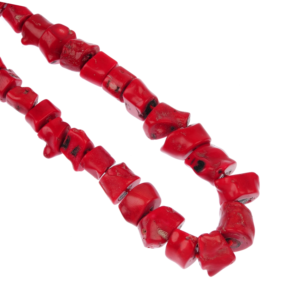 Two dyed coral necklaces, the first comprising of a series of slightly graduated irregular-shape