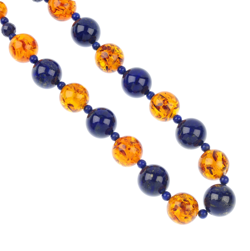 An amber and lapis lazili bead necklace, the spherical modified amber beads with spherical and