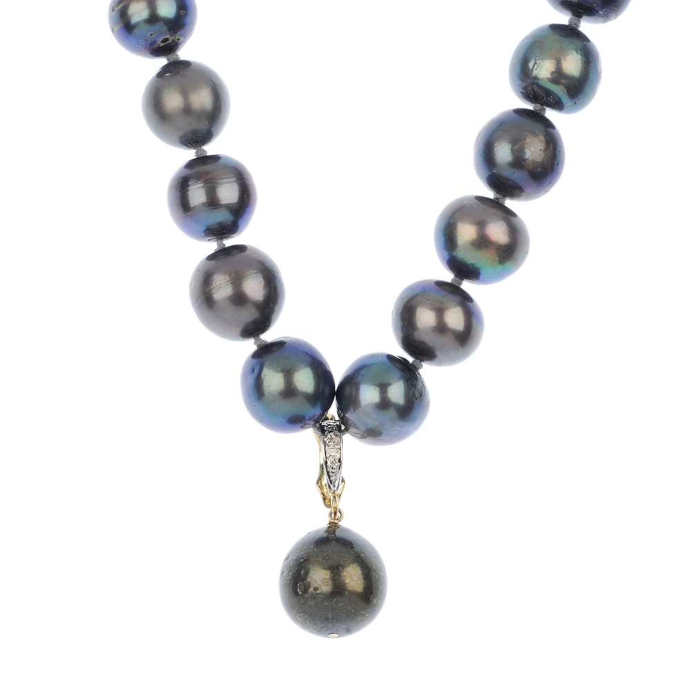 A dyed cultured pearl necklace with pearl separator, comprising a single strand of thirty-four dyed