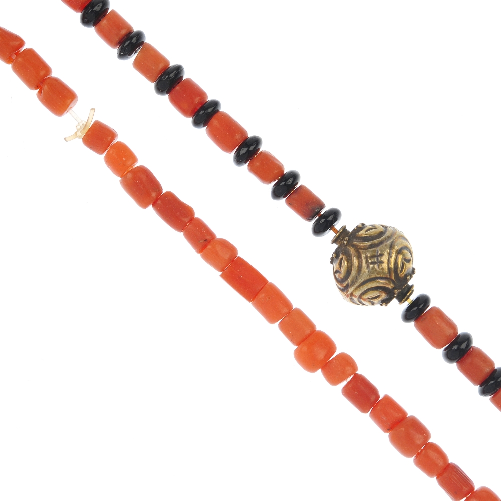 Two single strand coral bead necklaces, to include a single-row coral bead necklace with push-piece