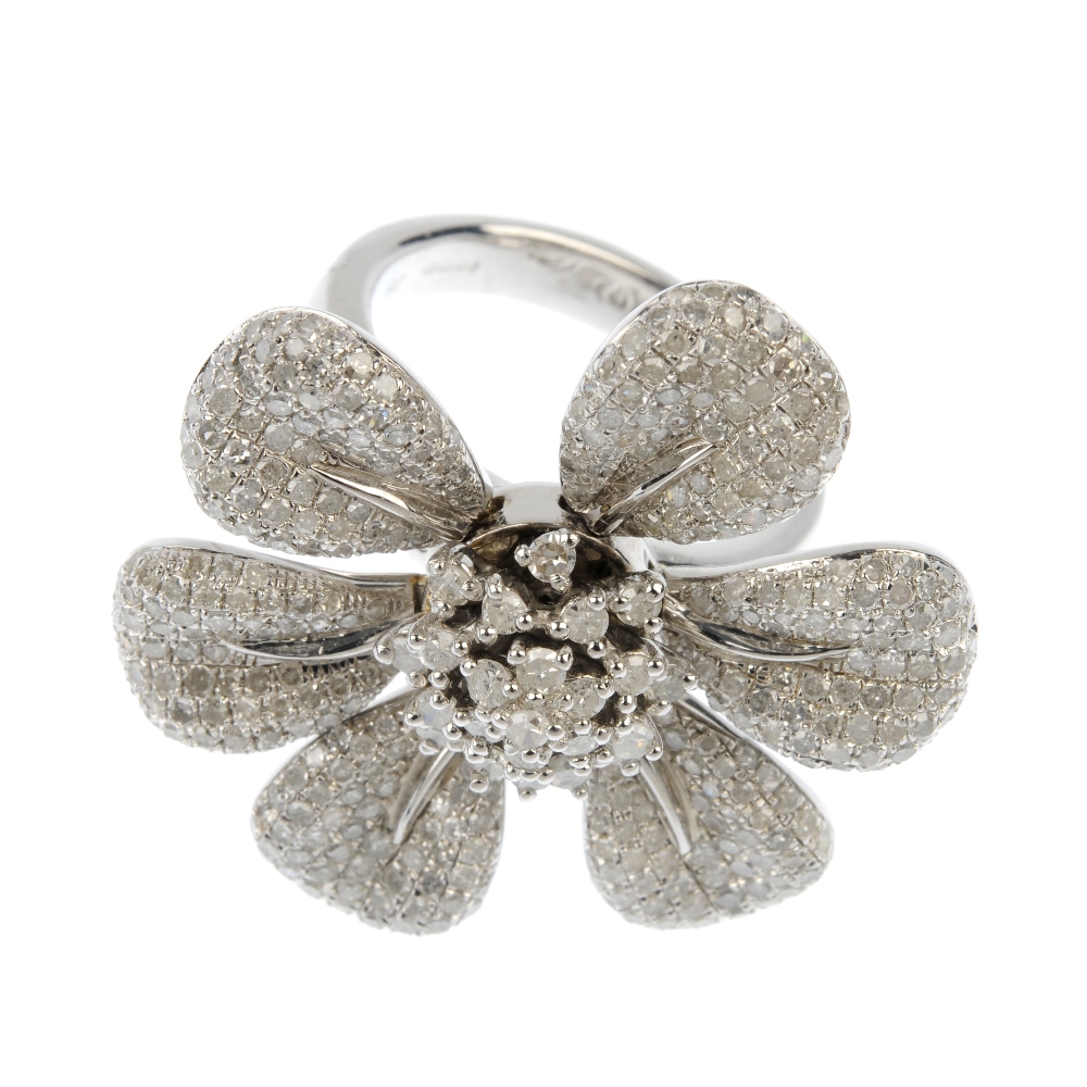 A silver diamond floral ring. The brilliant-cut diamond stepped cluster, with six articulated pave- - Image 2 of 4