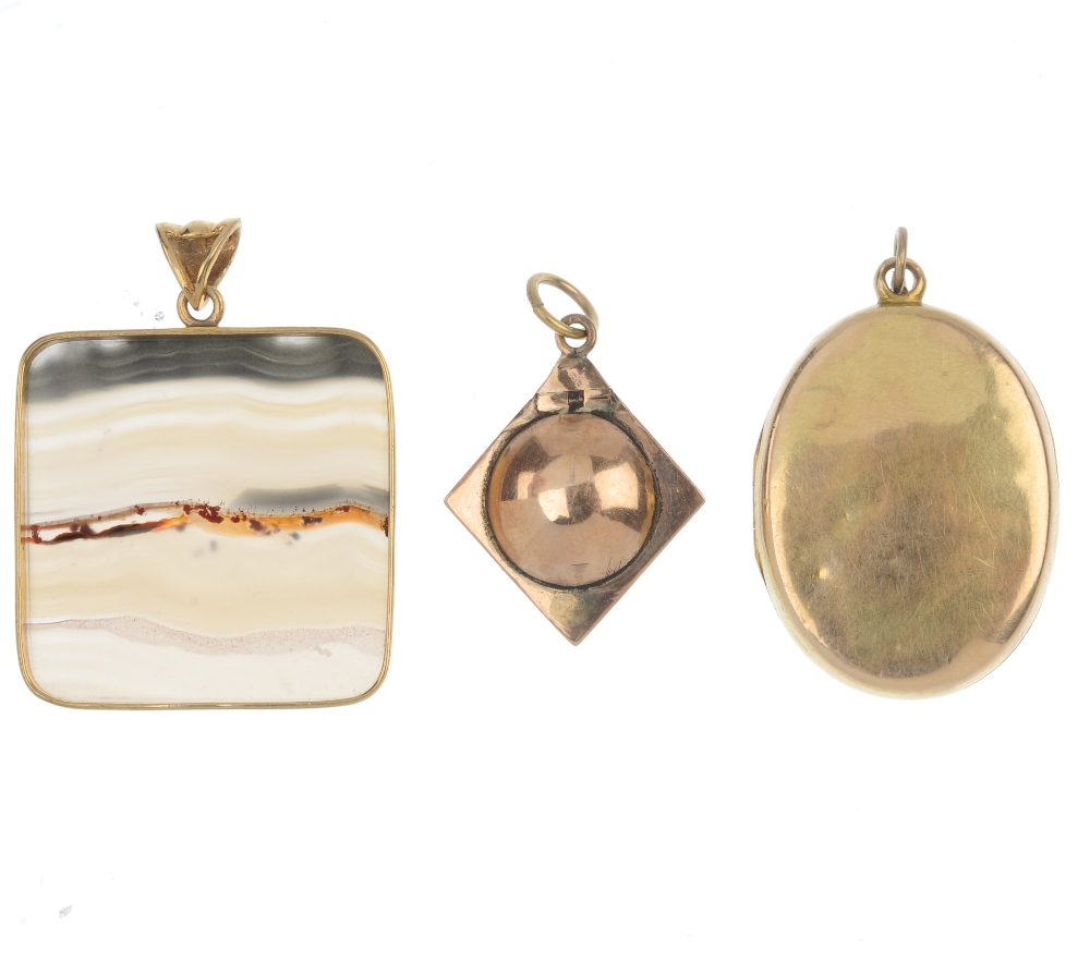 A selection of three pendants. To include a late Victorian gold monogrammed memorial locket, a 9ct - Image 2 of 2
