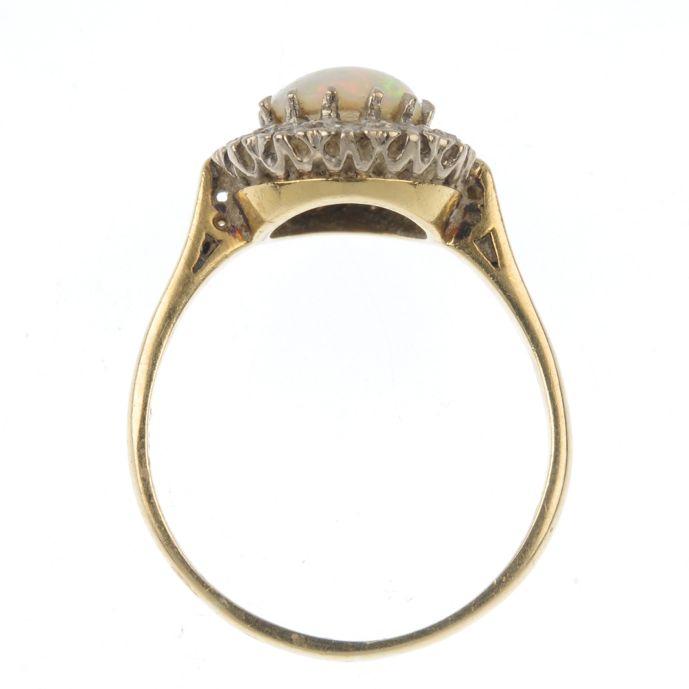 An 18ct gold opal and diamond cluster ring. The circular opal cabochon, within a single-cut diamond - Image 4 of 4