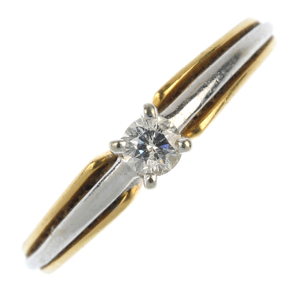 An 18ct gold diamond single-stone ring. Of bi-colour design, the brilliant-cut diamond, to the