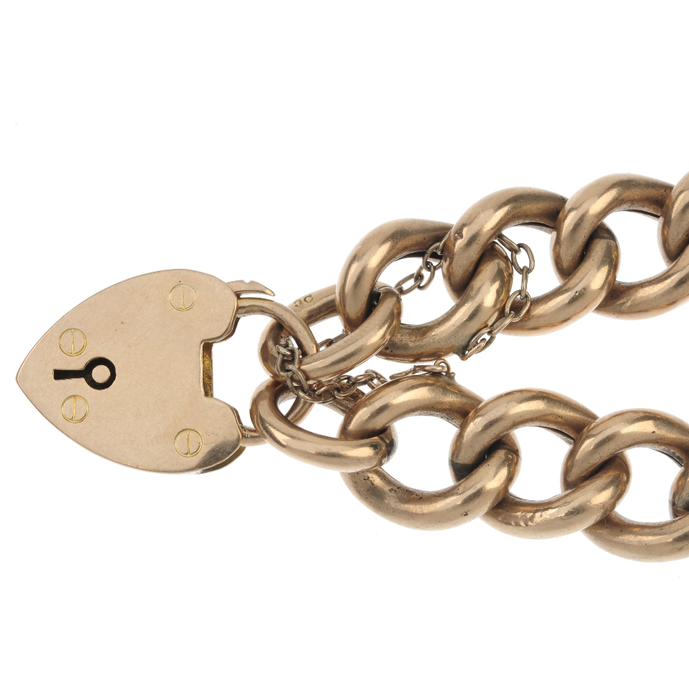 An Edwardian 9ct gold bracelet. The curb-link chain, to the padlock clasp. Hallmarks for - Image 2 of 2