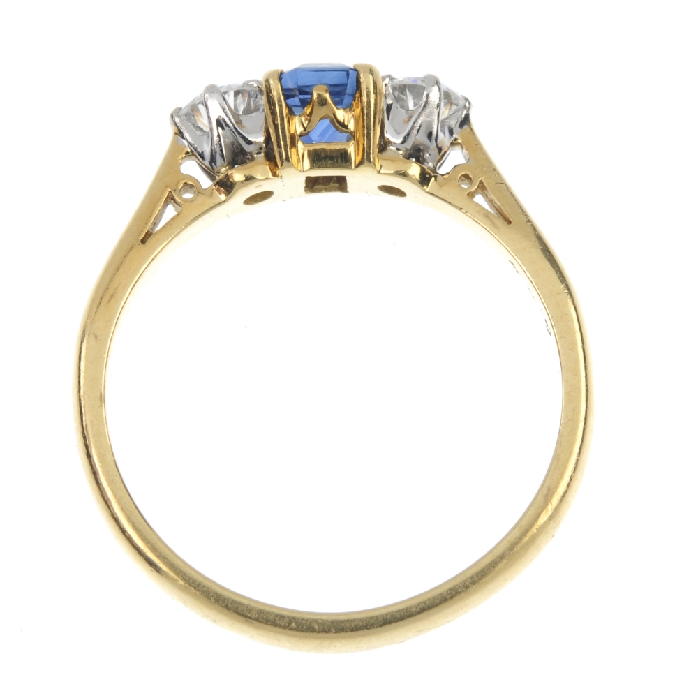 An 18ct gold sapphire and diamond three-stone ring. The rectangular-shape sapphire, with brilliant- - Image 4 of 4