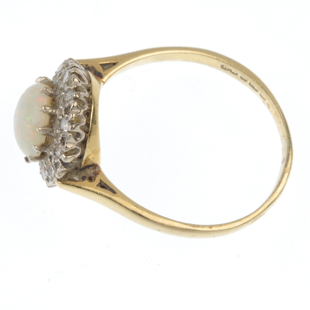 An 18ct gold opal and diamond cluster ring. The circular opal cabochon, within a single-cut diamond - Image 3 of 4