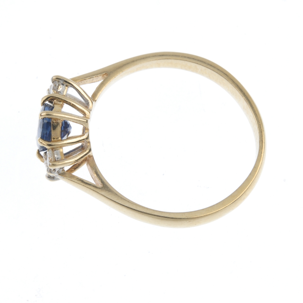 A 9ct gold sapphire and diamond ring. The oval-shape sapphire, with brilliant-cut diamond double - Image 3 of 4