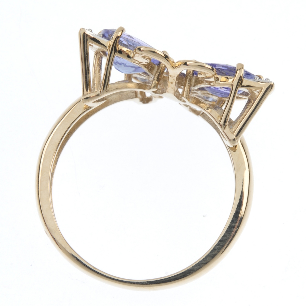 A 9ct gold diamond and tanzanite butterfly ring. The pear-shape tanzanite wings, with brilliant-cut - Image 4 of 4
