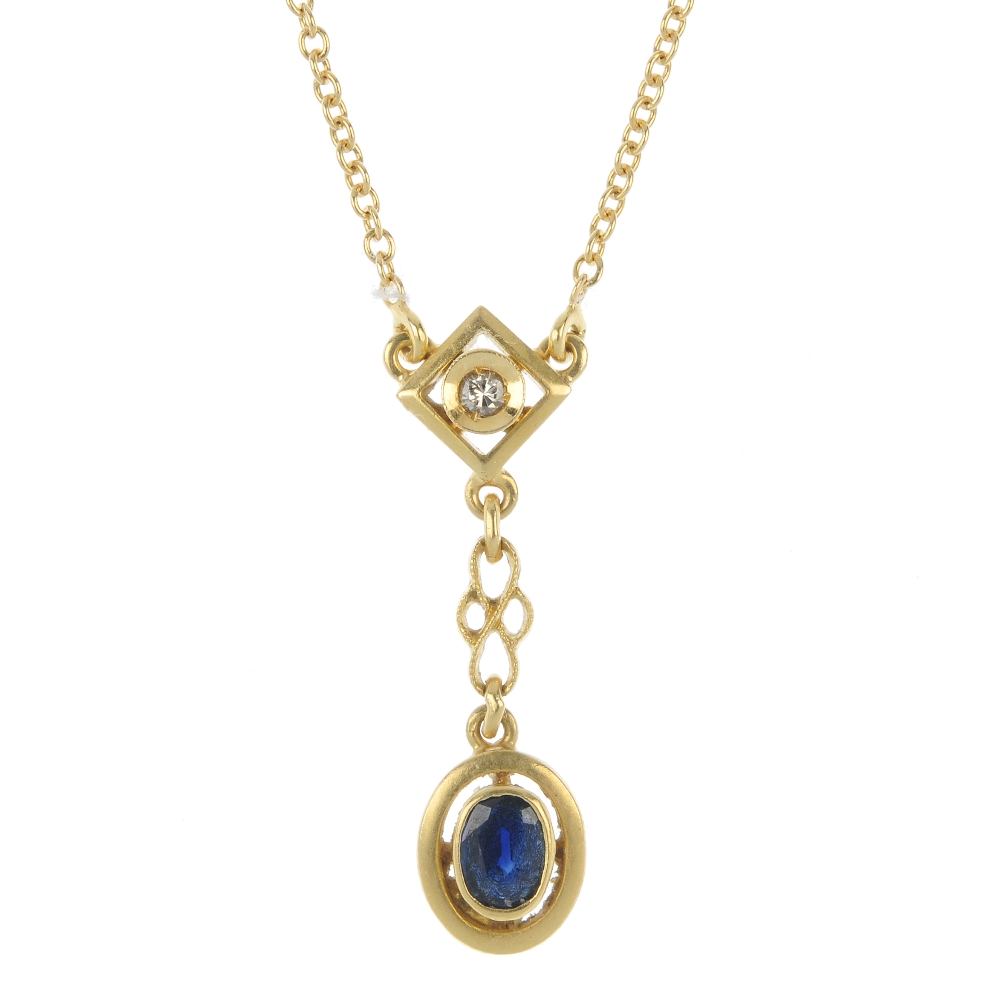 A sapphire and diamond pendant. The oval-shape sapphire drop, suspended from a brilliant-cut