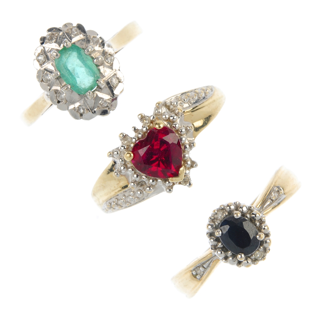 A selection of three 9ct gold gem-set cluster rings. To include an emerald and diamond ring, a