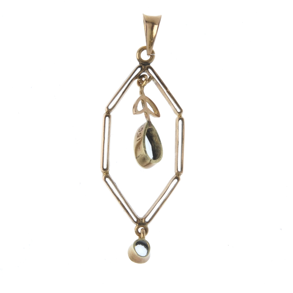 An early 20th century gold aquamarine pendant. Designed as a pear-shape aquamarine foliate drop, - Image 2 of 2