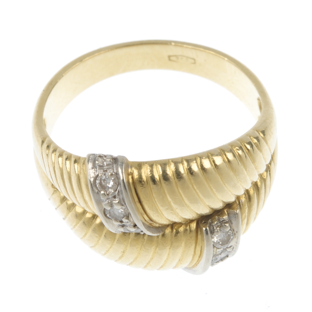 A diamond dress ring. Comprising two grooved panels, with brilliant-cut diamond line accents, to - Image 2 of 4