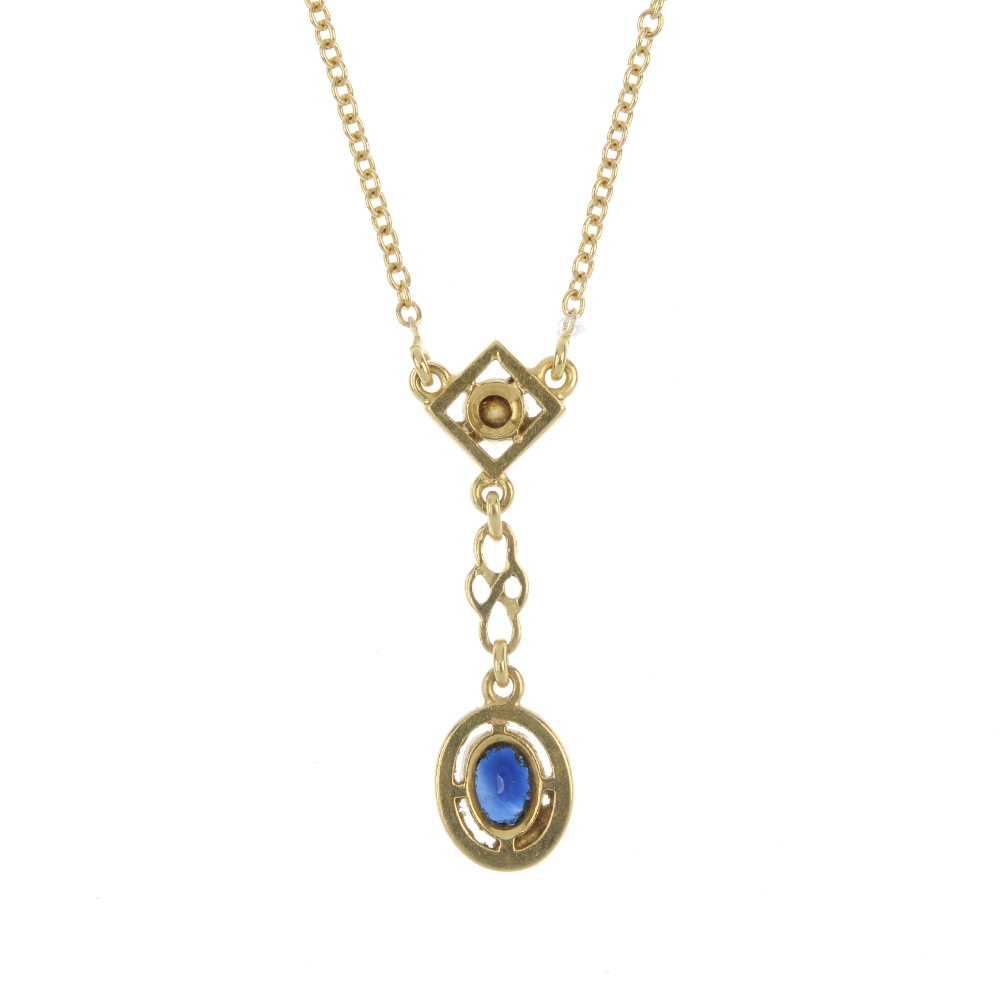 A sapphire and diamond pendant. The oval-shape sapphire drop, suspended from a brilliant-cut - Image 2 of 3