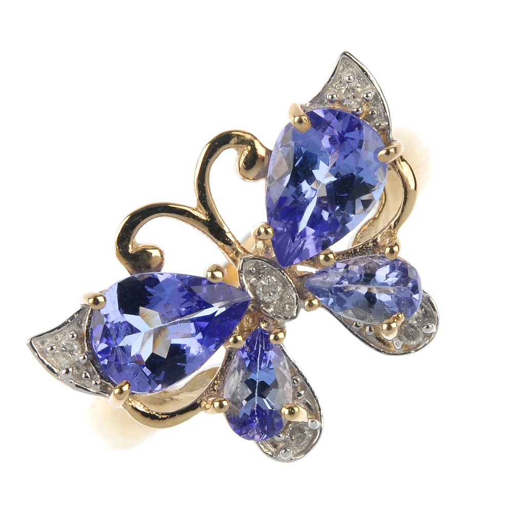 A 9ct gold diamond and tanzanite butterfly ring. The pear-shape tanzanite wings, with brilliant-cut