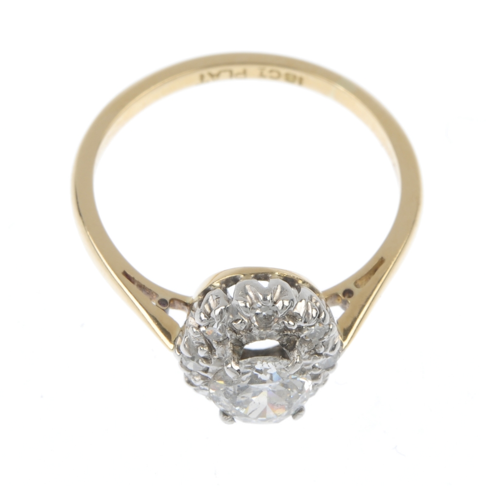 A diamond cluster ring. The old-cut diamond, within a single-cut diamond illusion surround, to the - Image 2 of 4