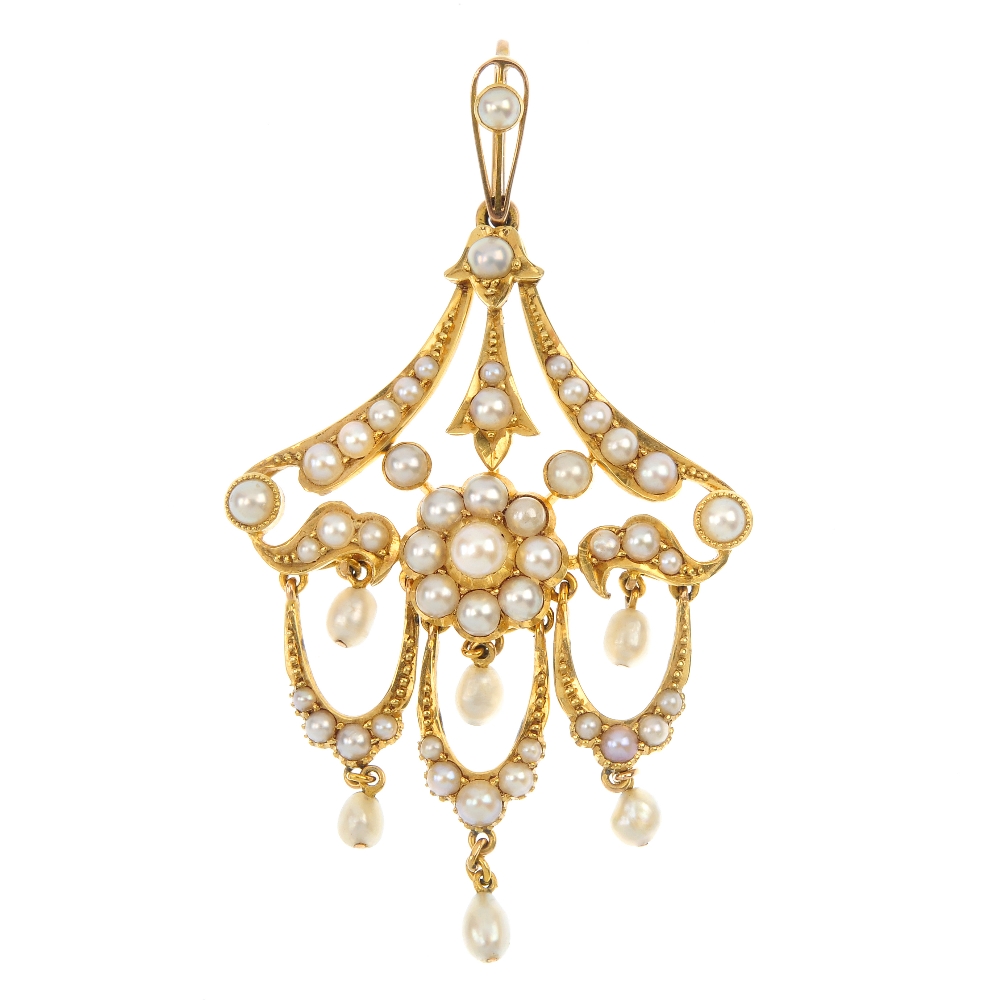 An early 20th century 18ct gold split pearl pendant. Designed as a series of three split pearl