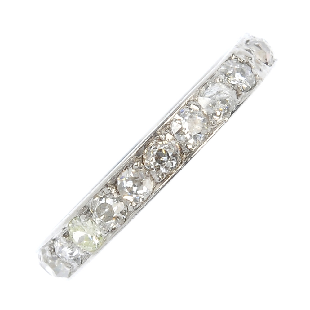 An early 20th century platinum diamond full-circle eternity ring. The old-cut diamond line, to the