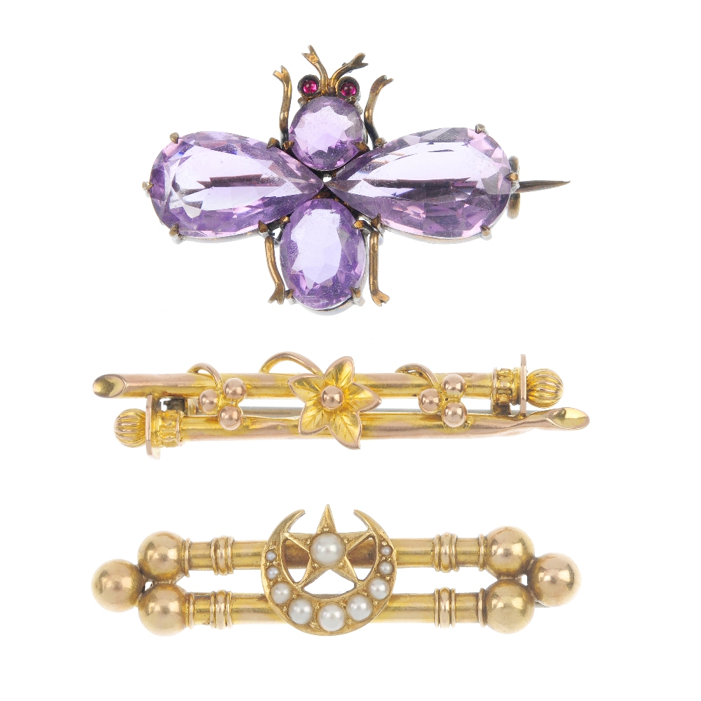 A selection of three early 20th century brooches. To include a silver gilt amethyst bee brooch, a