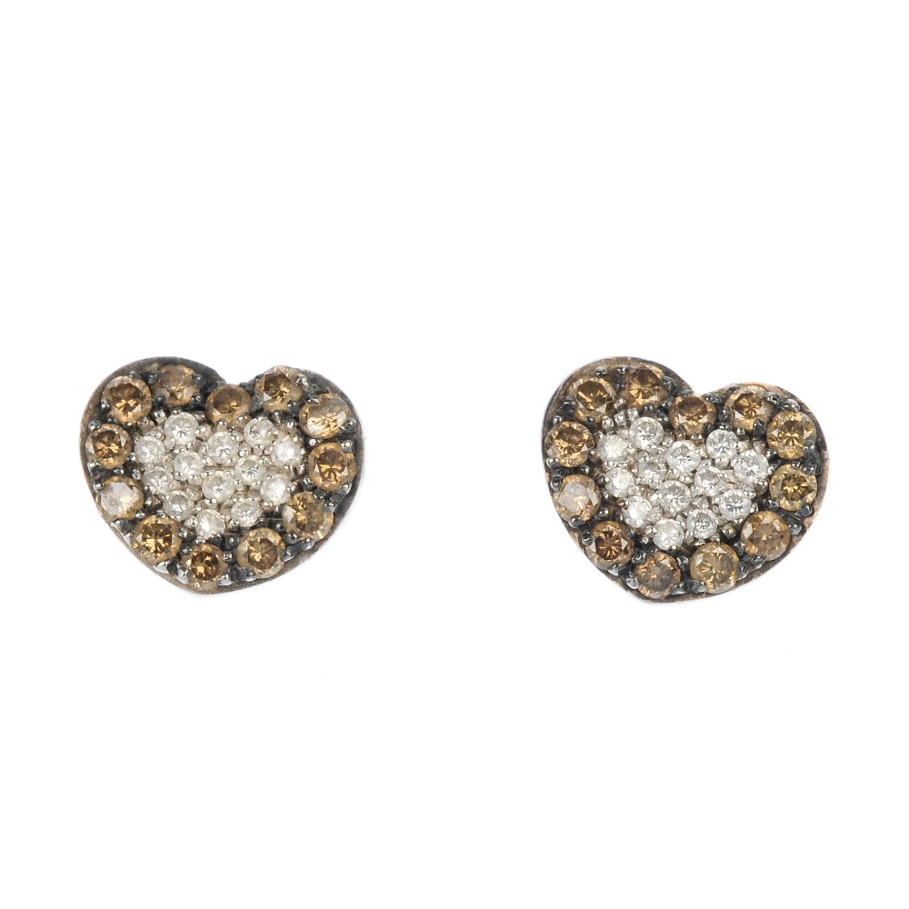 A pair of 18ct gold diamond and coloured diamond ear studs. Each designed as a brilliant-cut