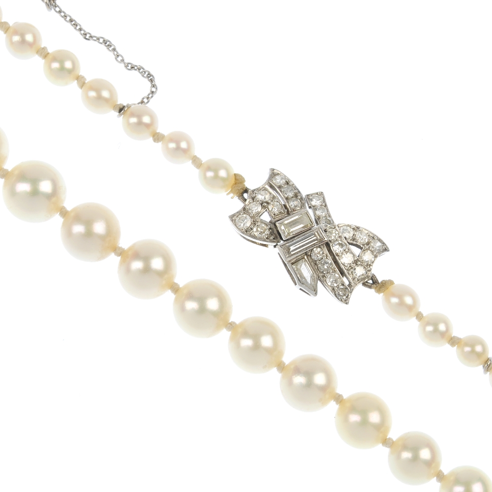 A cultured pearl necklace with an early 20th century diamond clasp. Comprising a series of eighty-