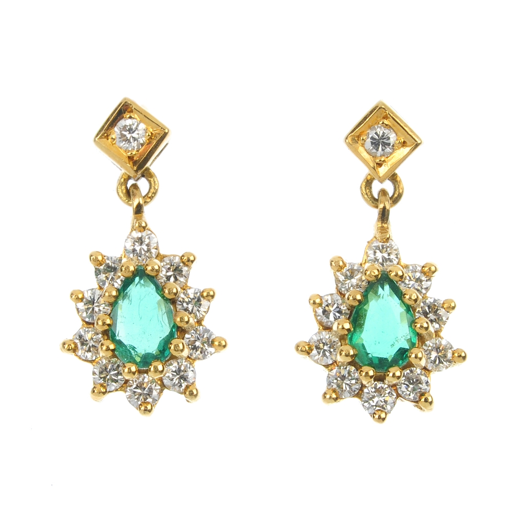 A pair of 18ct gold emerald and diamond ear pendants. Each designed as a pear-shape emerald and