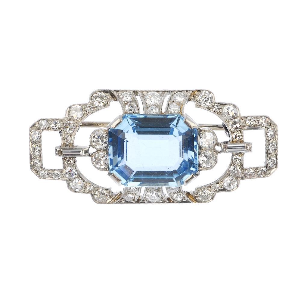 A mid 20th century platinum aquamarine and diamond brooch. Of openwork design, the rectangular-shape