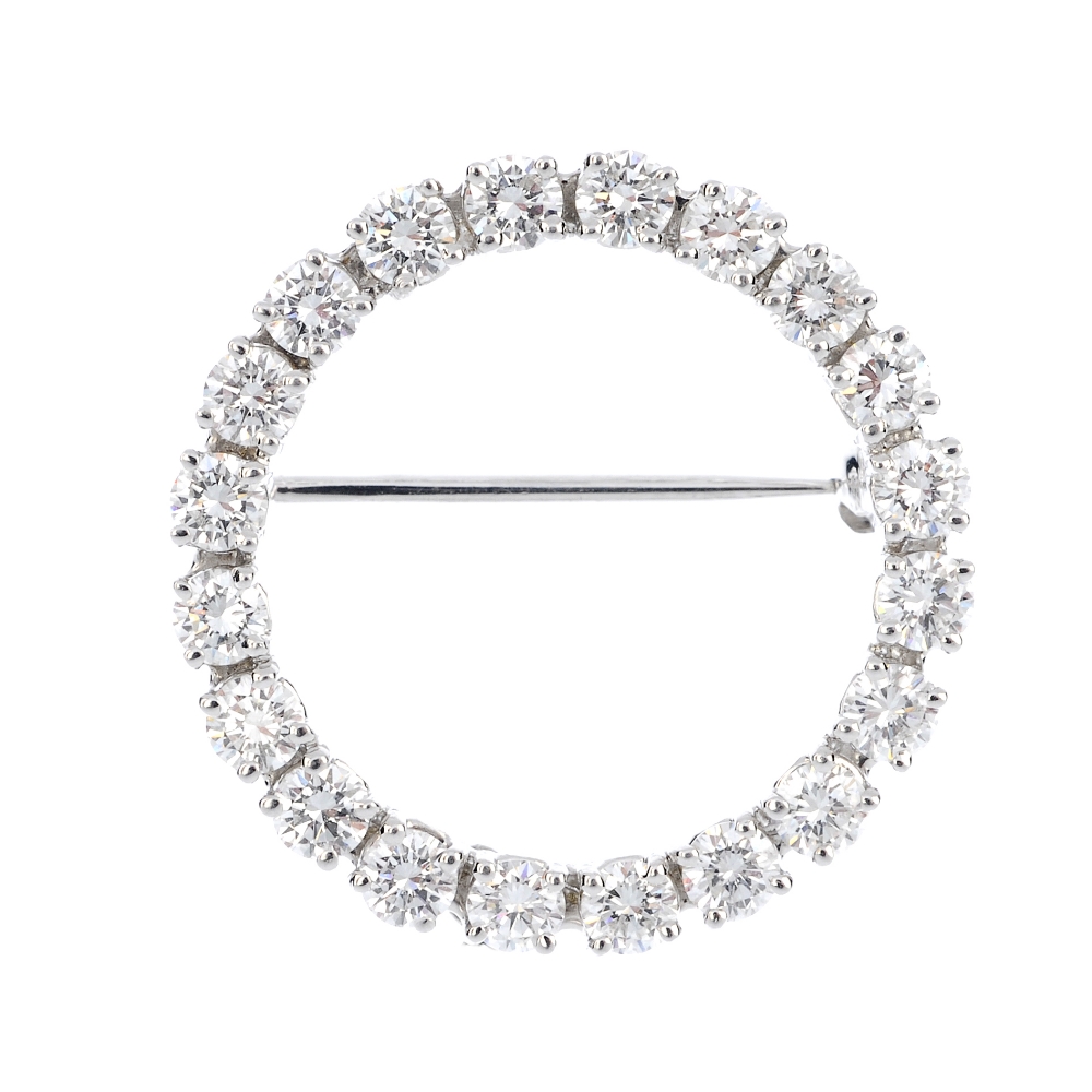 A diamond wreath brooch. Of circular-shape outline, set throughout with brilliant-cut diamonds.