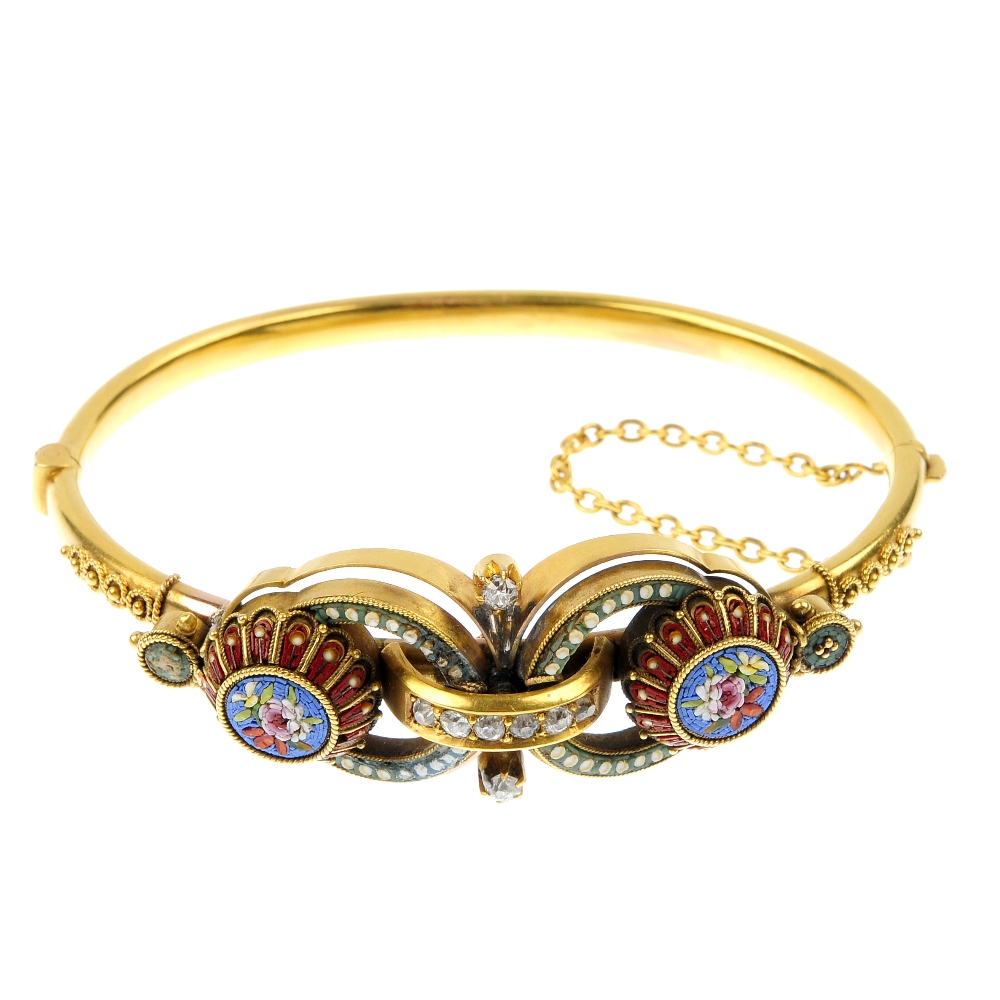 A late 19th century 15ct gold diamond micro mosaic hinged bangle. Of foliate design, the front