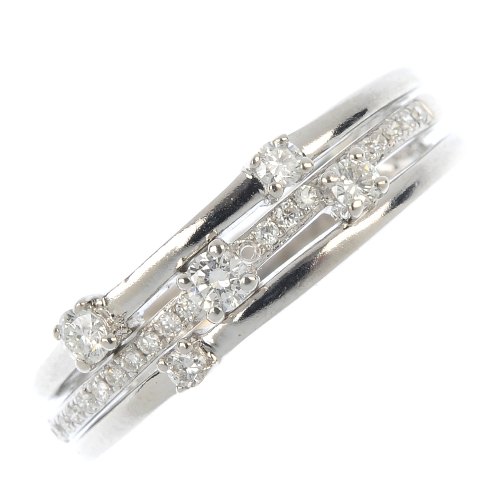 A diamond dress ring. Designed as scattered brilliant-cut diamonds, across the similarly-cut
