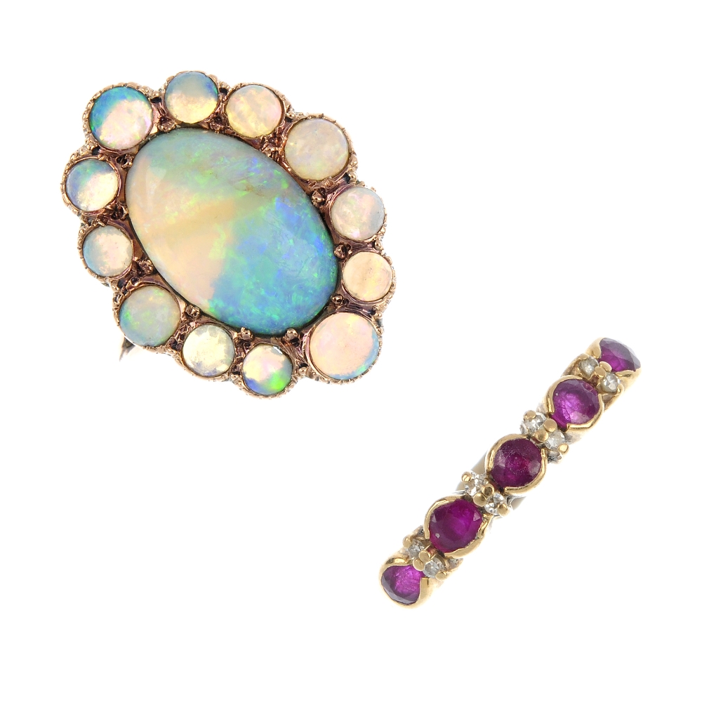 Two gem-set rings. To include an oval and circular opal cabochon cluster ring, together with a 9ct