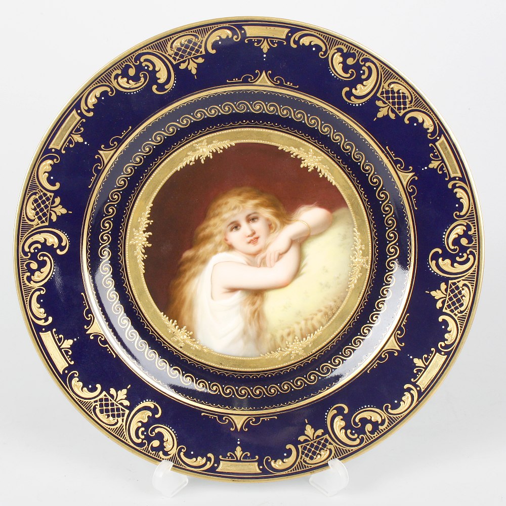 A Vienna porcelain cabinet plate, hand-painted with a half-length portrait of a young girl, signed