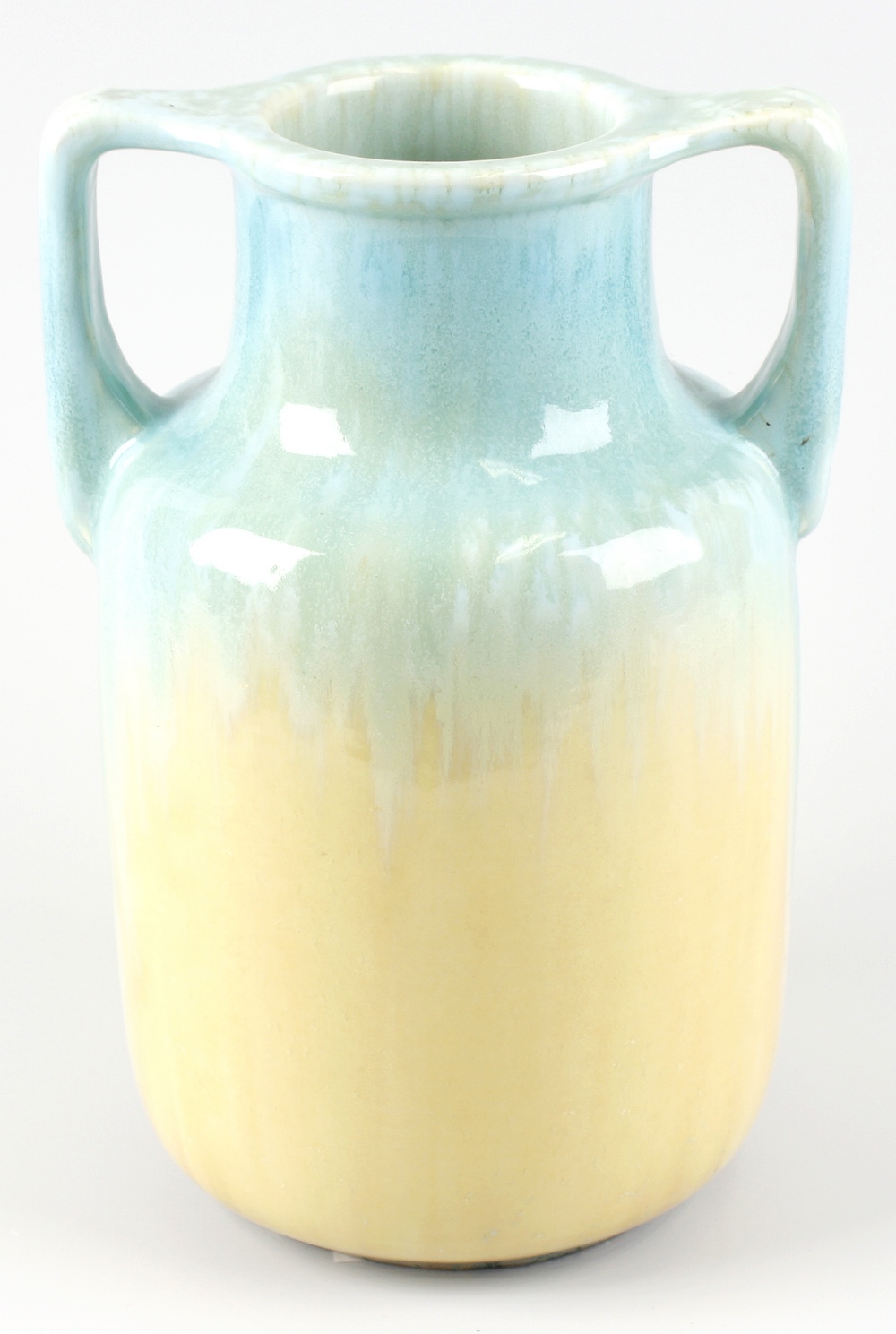 A Ruskin pottery twin handled vase of ovoid form, decorated in a merging blue and yellow glazed