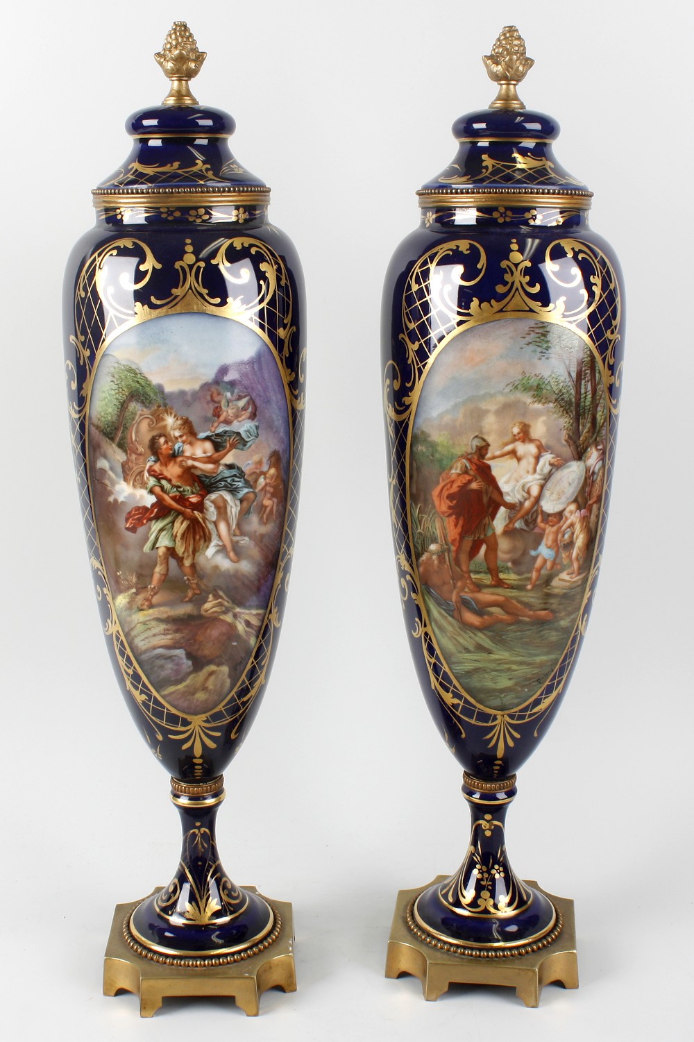 A good pair of 19th century Sevres style porcelain urns. Each of tall ovoid form, decorated with